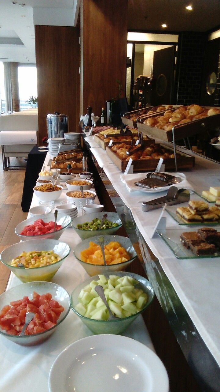 Breakfast buffet with fresh fruit bowls, cereals and baked pastries at DreamWoods, Masvingo