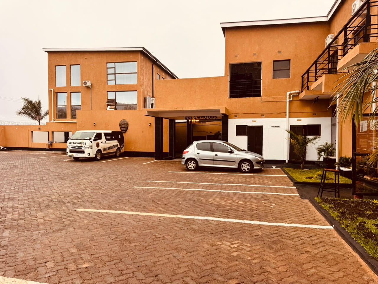 DreamWoods building exterior and parking in Masvingo