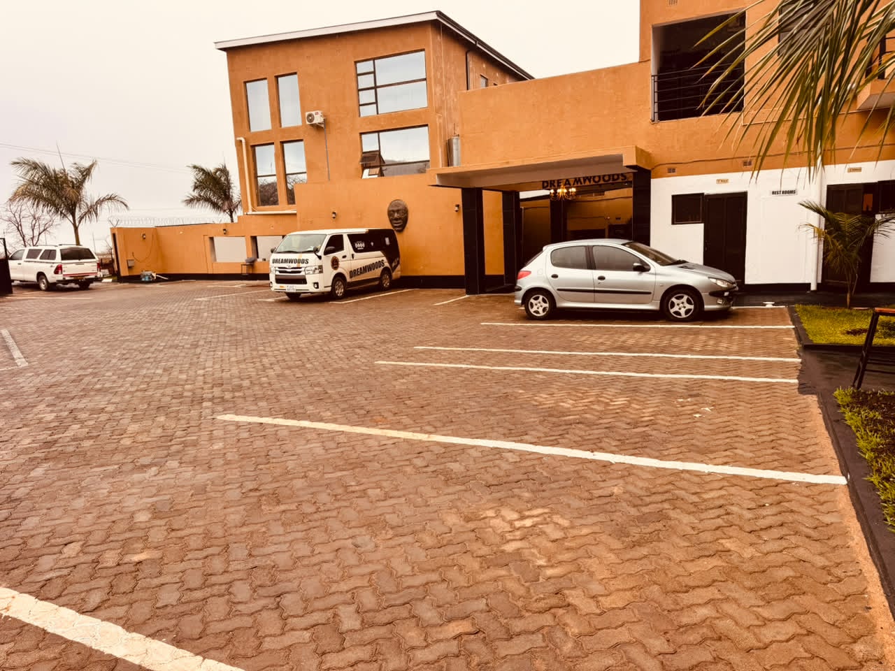 Paved parking in front of DreamWoods in Masvingo